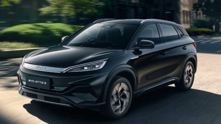 BYD ATTO 3 electric SUV driving on a city road, symbolizing BYD’s rise over Tesla in 2024